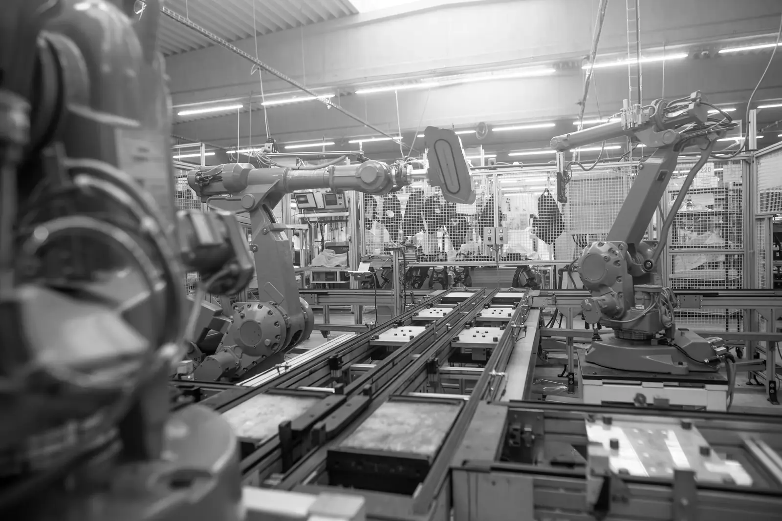 Industrial robot arms on an automated production line